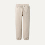 Beige sweatpants with a pocket on a white background. Available at Be Charmed. 