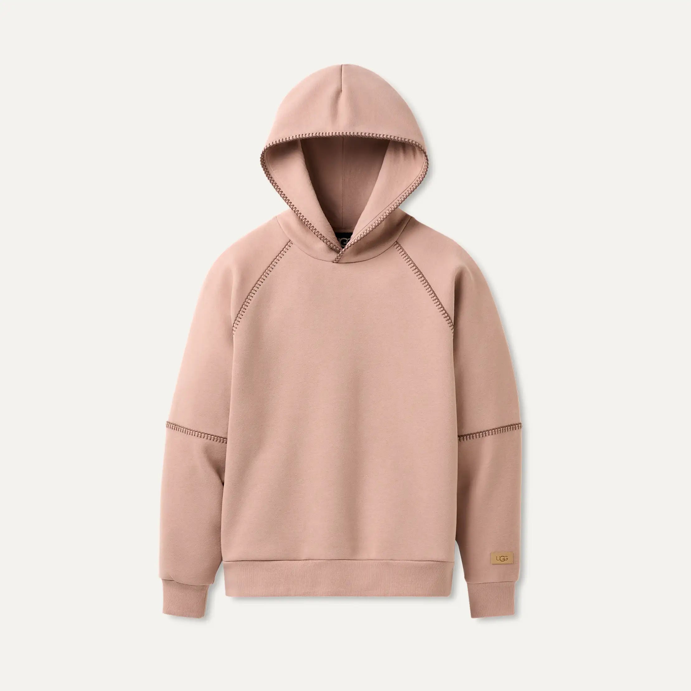 Dawn Patrol Pink UGG hoodie on a light beige background. Available at Be Charmed. 