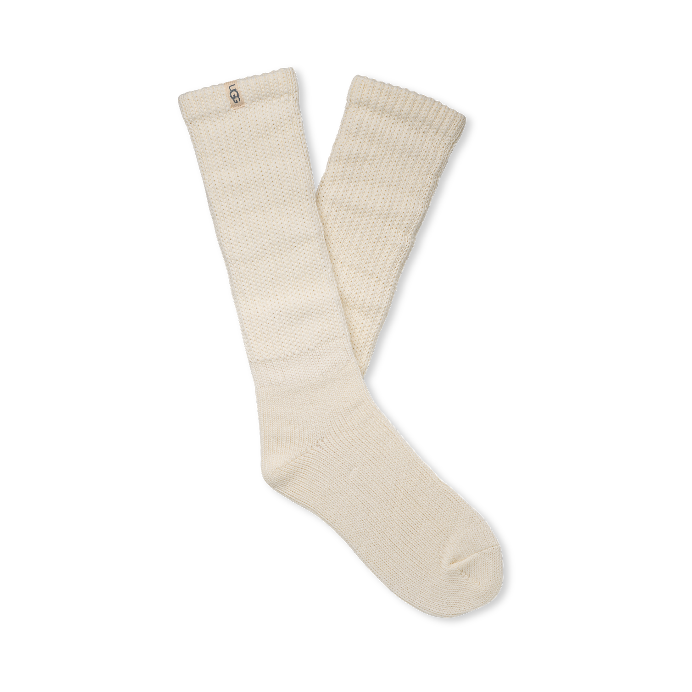 Pair of beige tyla ugg socks on a white background. Available at Be Charmed. 