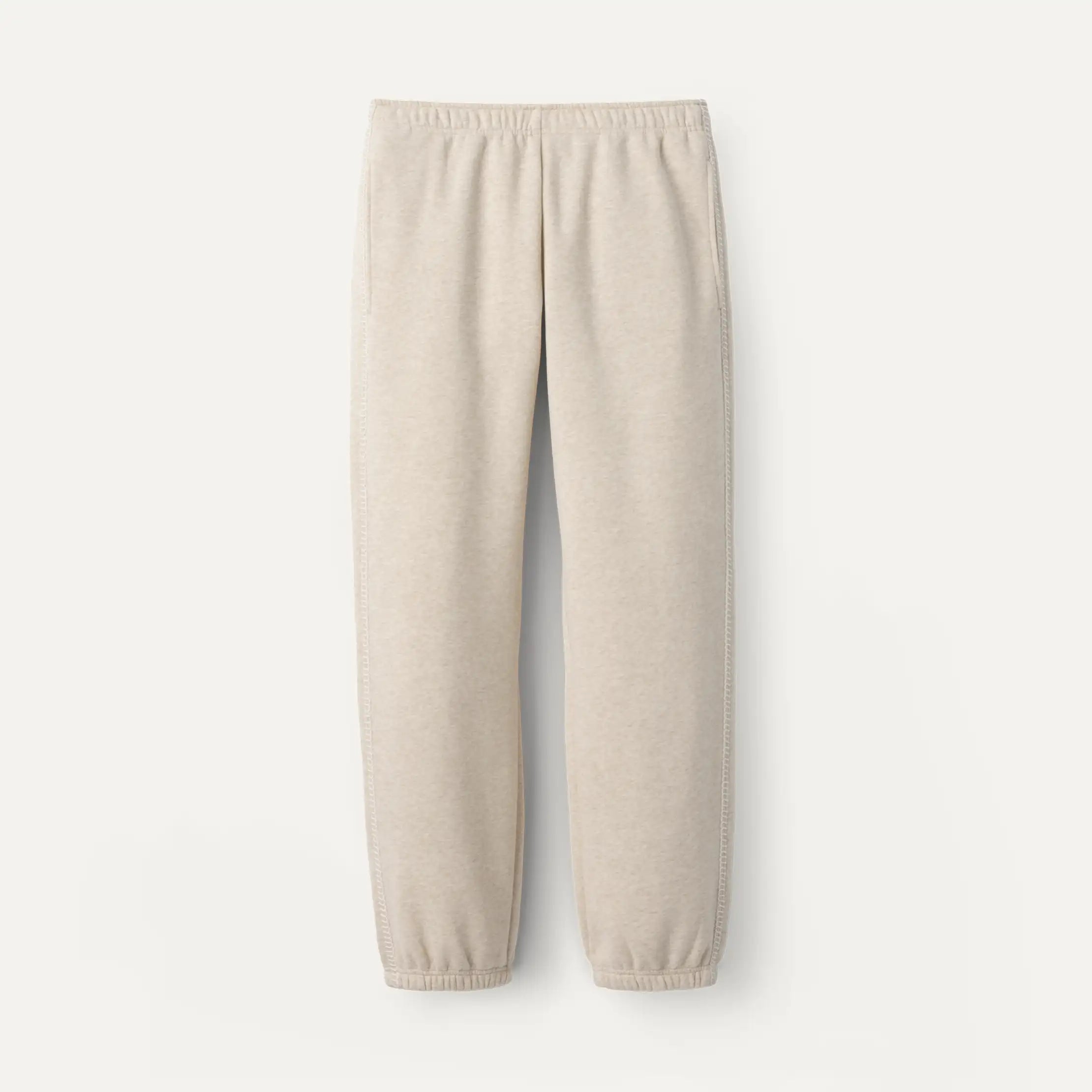 Beige UGG sweatpants on a white background. Available at Be Charmed. 