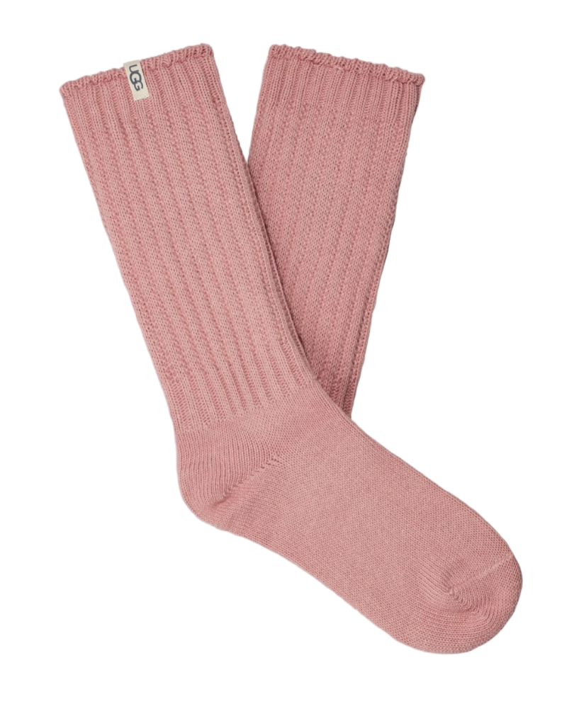 A pair of pink UGG women's slouchy crew socks with a ribbed texture. Available at Be Charmed. 