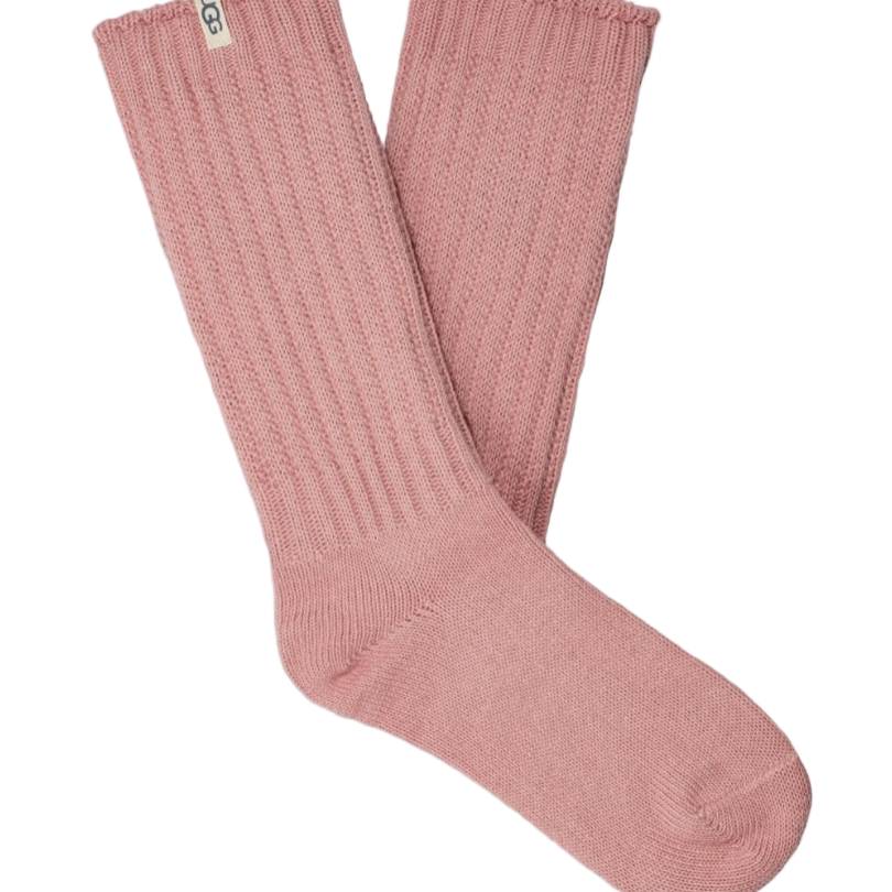 A pair of pink UGG women's slouchy crew socks with a ribbed texture. Available at Be Charmed. 