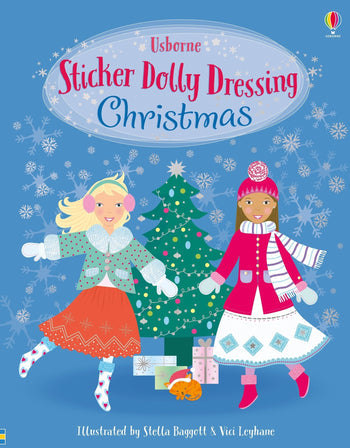 Book cover of 'Sticker Dolly Dressing Christmas' with two dolls and a Christmas tree on a blue background. Available at Be Charmed