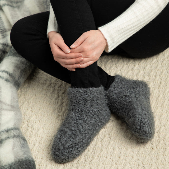 Charcoal Demdaco Giving Collection slipper booties, plush chenille in pink, grey & charcoal color options, sizes S–L, soft lining—available at Be Charmed.