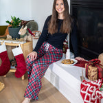 Woman Wearing Hello Mello Holiday Lounge Pants – All Wrapped Up design, cozy festive pajama pants perfect for lounging or gifting, available at Be Charmed.