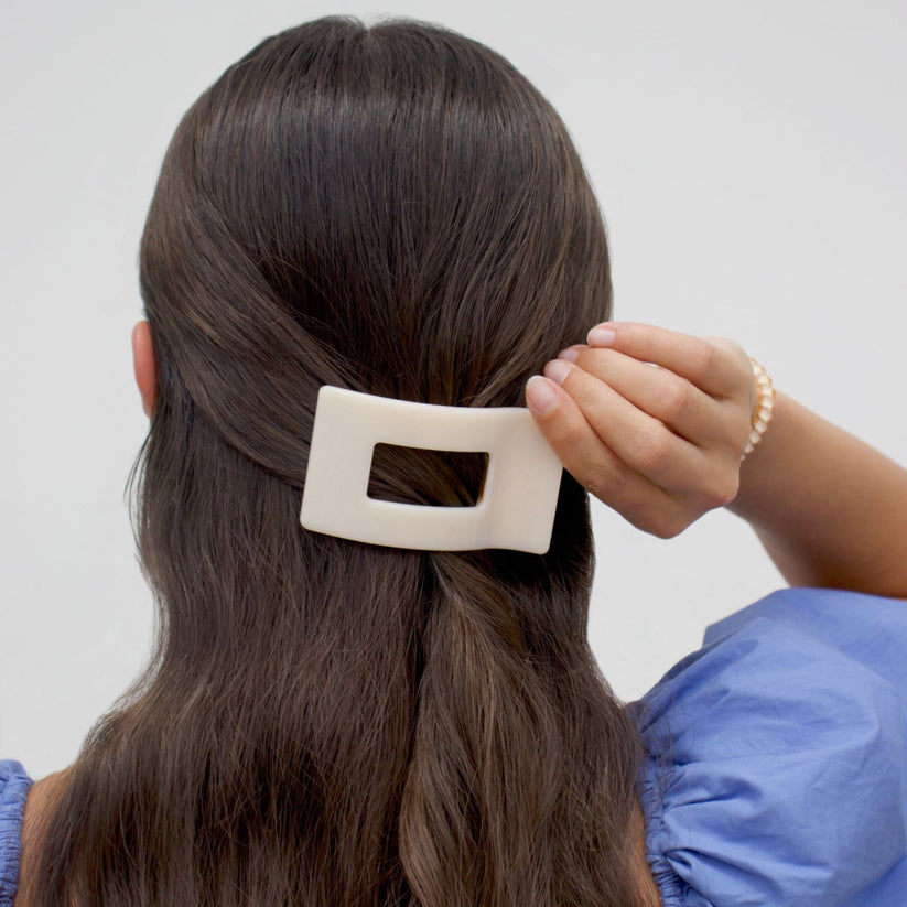 Woman Wearing a Flat Rectangle Hair Clip with bendable teeth, sleek and secure hold—available at Be Charmed.