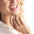 Woman wearing a enewton Classic Gold Band Ring made with 14k gold-filled material. Minimalist and stackable, perfect for daily wear. Available at Be Charmed.