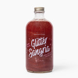 Bottle of Wood Stove Kitchen 'Glitter Sangria' on a white background. Available at Be Charmed