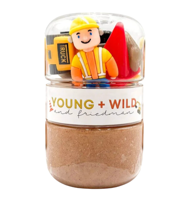Jar with construction-themed toys and 'Young & Wild' branding on a white background. Available at Be Charmed