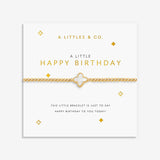 Gold bracelet on a 'Happy Birthday' card with decorative elements. Available at Be Charmed