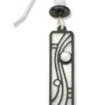 Adajio black and white geometric pendant earring on a white background. Available at Be Charmed