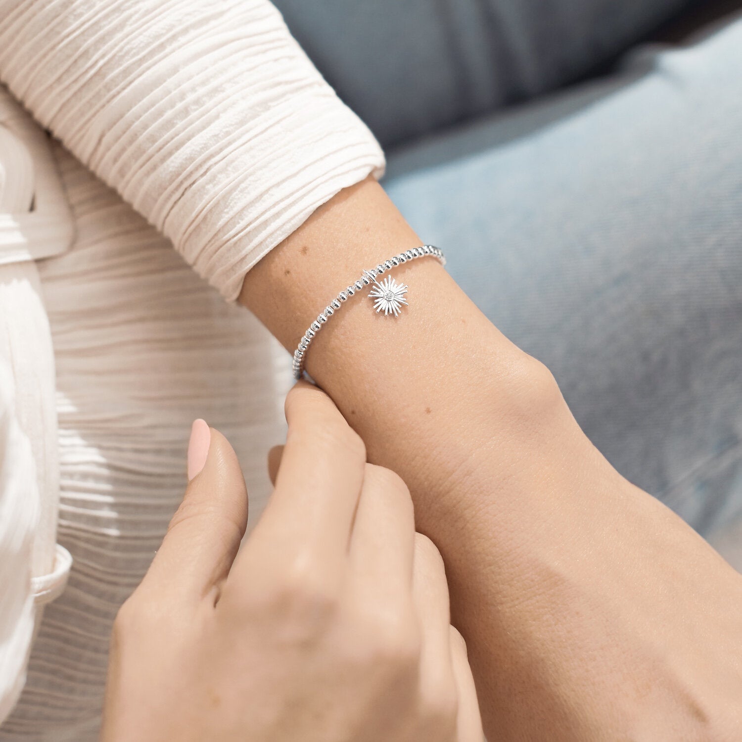 Woman Wearing A Littles & Co Silver Happy Retirement  Bracelet