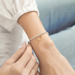Woman Wearing A Littles & Co Silver Love and Strength Bracelet