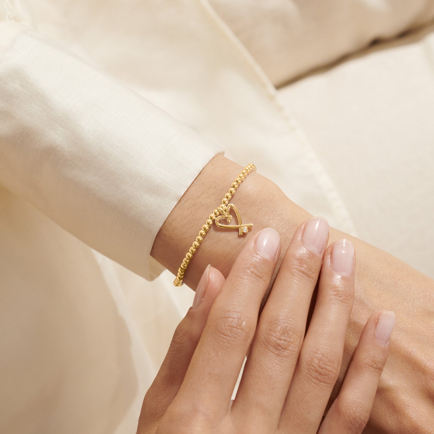 Woman Wearing A Littles & Co Gold Beautiful Wife Bracelet 
