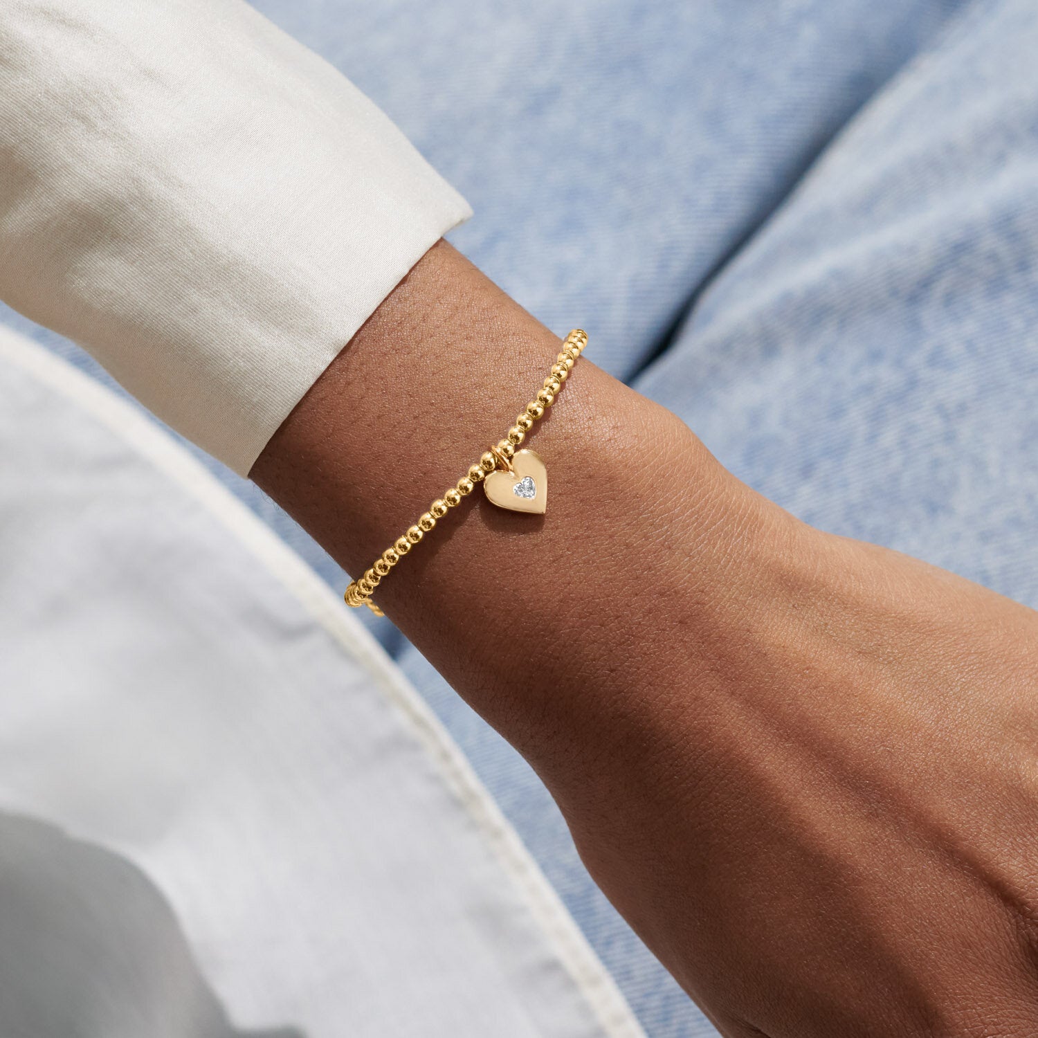 Woman Wearing A Littles & Co Gold Love You With All My Heart Bracelet 