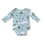 Angel Dear Lap Shoulder Bodysuit – Winter Fun Skiers design with playful skier print, lap shoulders, and snaps. Available at Be Charmed.
