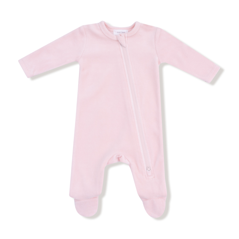 ngel Dear Velour Footie – Teddy Bear Pink Pink velour baby onesie with a zipper on a white background. Available at Be Charmed.