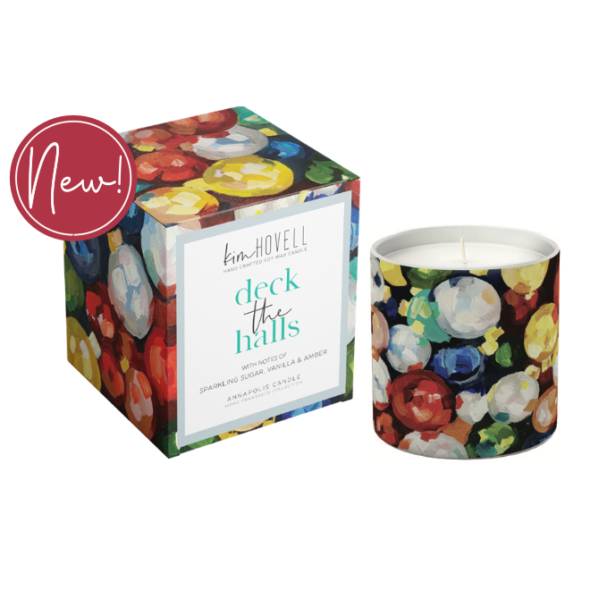 Annapolis Candle Kim Hovell Deck The Halls Boxed Candle – festive holiday scent with signature artwork. Available at Be Charmed.