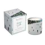 Annapolis Candle Kim Hovell Slope Slide Boxed Candle – crisp winter scent with signature artwork. Available at Be Charmed.