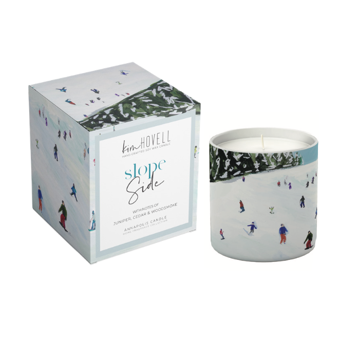 Annapolis Candle Kim Hovell Slope Slide Boxed Candle – crisp winter scent with signature artwork. Available at Be Charmed.