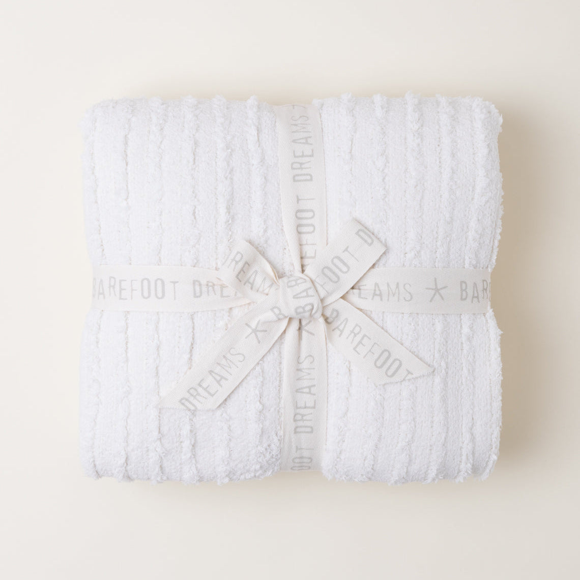 Barefoot Dreams Cream CozyChic Angular Blanket tied with White Bow
