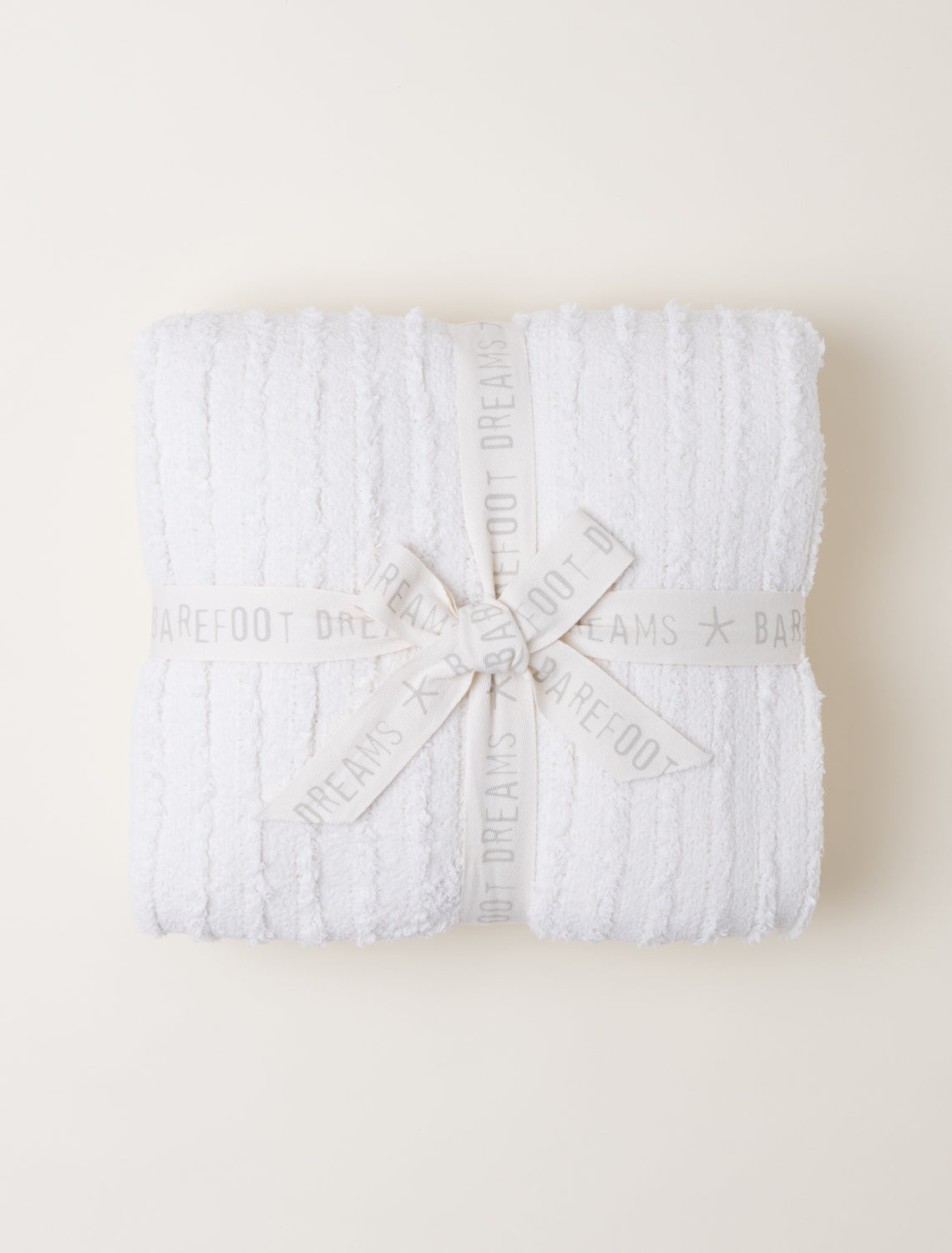 Barefoot Dreams Cream CozyChic Angular Blanket tied with White Bow