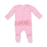 An Angel Dear candy pink long-sleeve footed sleeper with a ruffled waistband and white polka dot foot covers, shown from the back on a white background. Available at Be Charmed