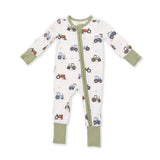 An Angel Dear baby long-sleeve footed sleeper with a white background, olive green trim, and an all-over tractor print in blue, red, and brown. Available at Be Charmed