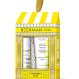 Beeckman 1802 Kindness Cafe gift set containing a goat milk hand cream and hand wash, presented in a yellow and white storefront-style box with a hanging loop. Available at Be Charmed