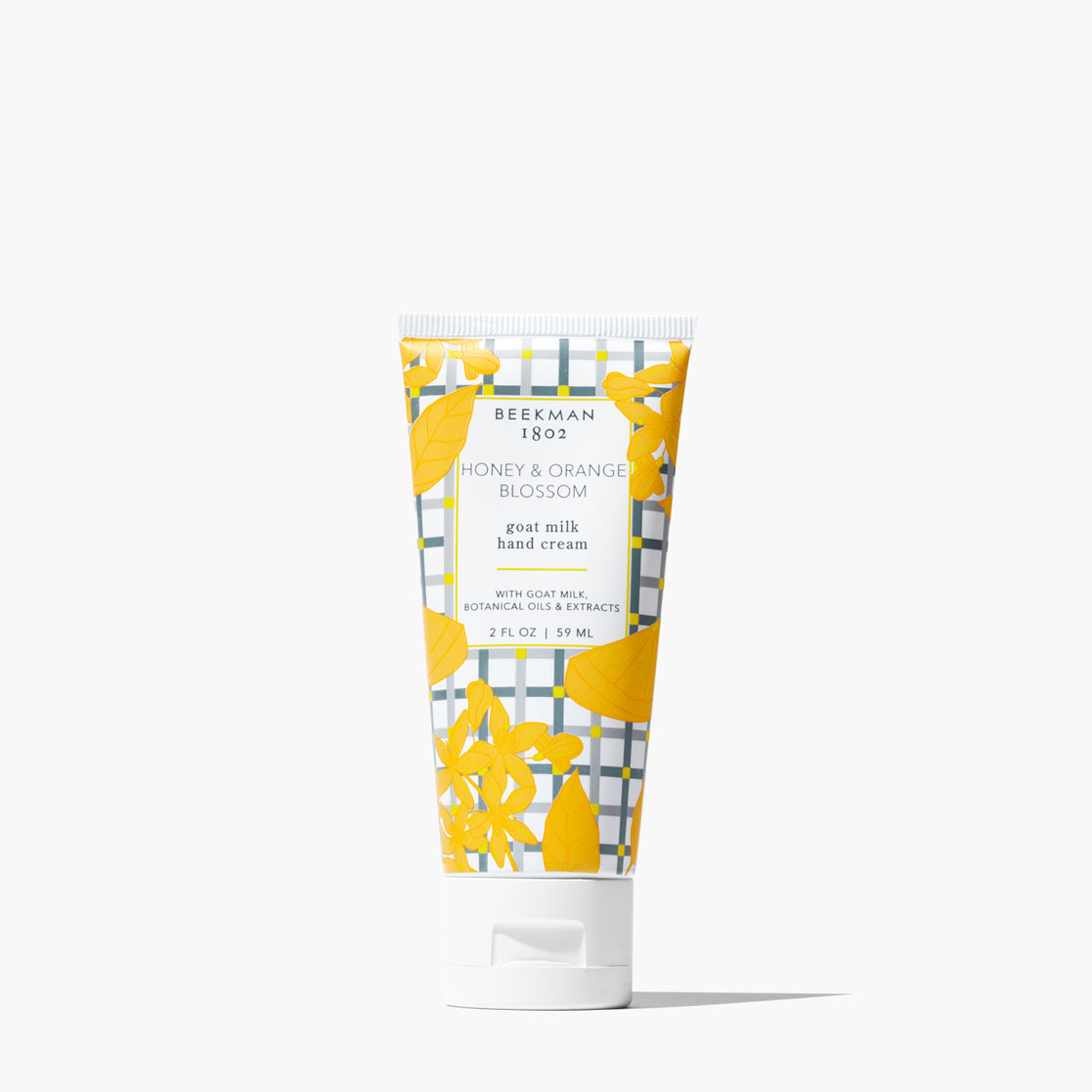 Beekman 1802 goat milk hand cream with honey and orange blossom scent on a white background. Available at Be Charmed