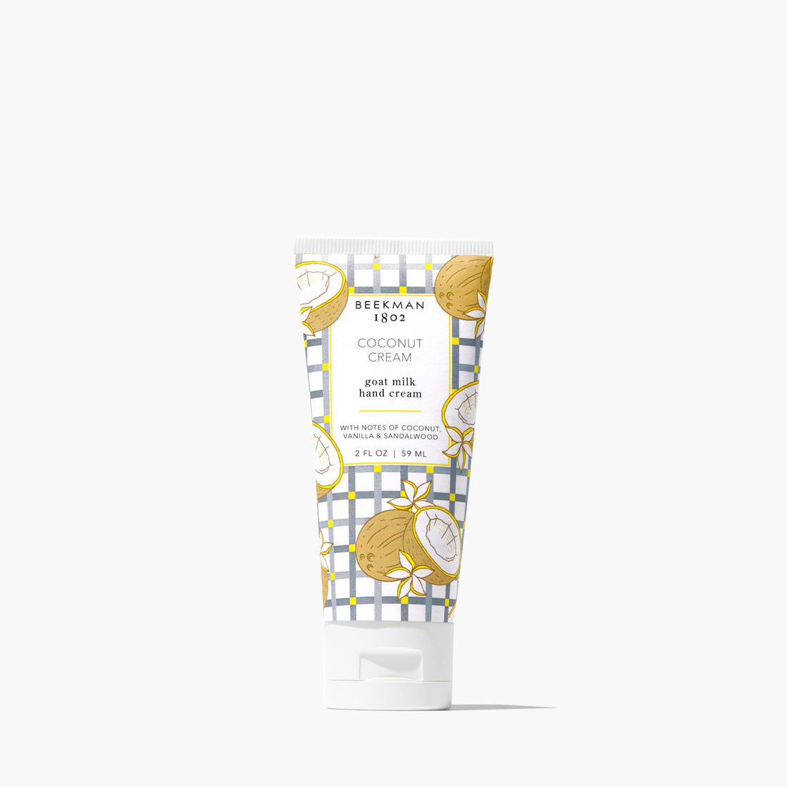 Beekman 1802 Coconut Cream goat milk hand cream tube on a white background. Available at Be Charmed
