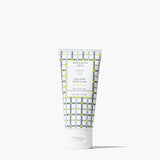 A squeeze tube of Beerman 1853 Fresh Air goat milk hand cream, featuring a white and gray plaid pattern with yellow accents, on a clean white background. Available at Be Charmed