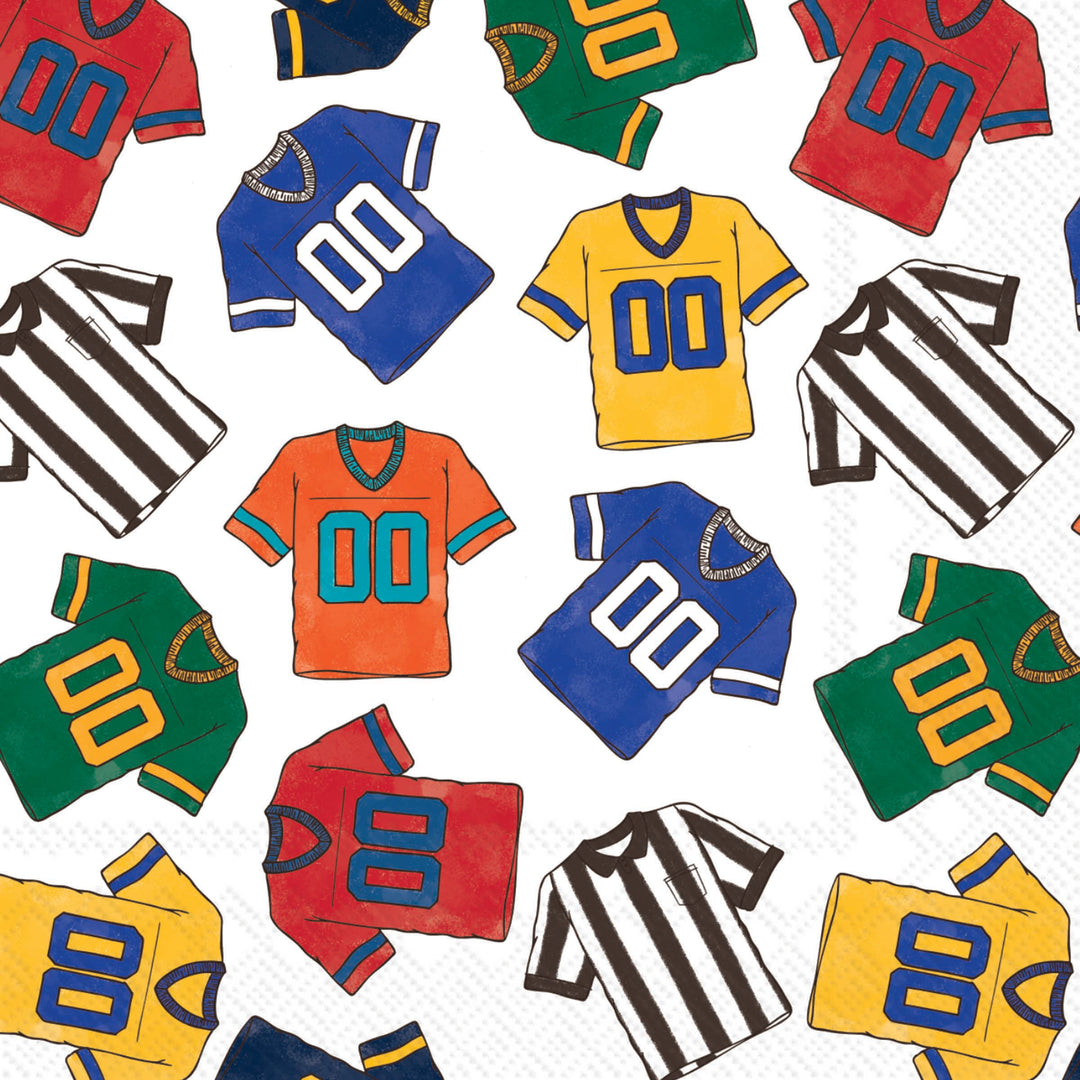 A repeating pattern of illustrated sports jerseys and referee shirts in multiple colors on a Boston International Cocktail Napkin available at Be Charmed