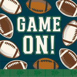 Pattern of footballs with 'GAME ON!' text on a Boston International fall Cocktail Napkin available at Be Charmed