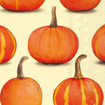 A Boston International guest towel with a repeating pattern of illustrated orange pumpkins with brown stems on a pale cream background with a subtle geometric texture. Available at Be Charmed