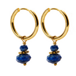 A pair of CAI gold hoop earrings with small lapis stone beads dangling below, shown on a plain white background. Available at Be Charmed
