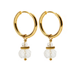 A pair of CAI gold hoop earrings with small white quartz stone beads dangling below, shown on a plain white background. Available at Be Charmed