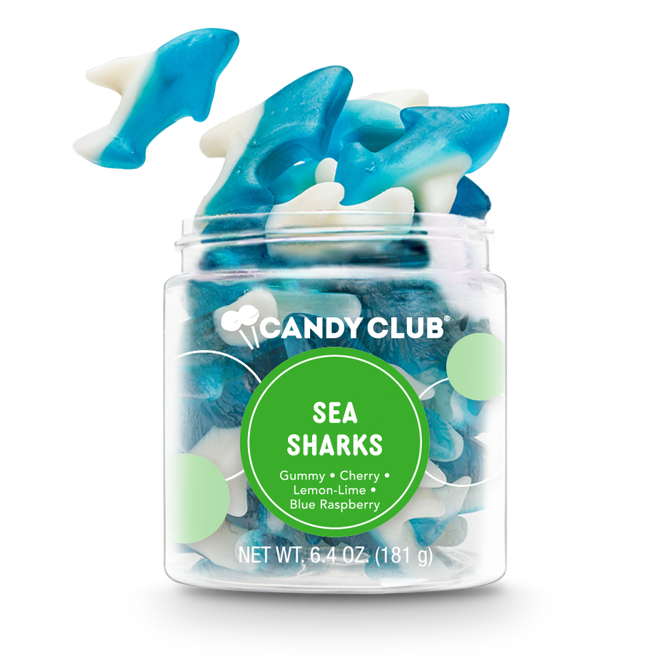 Jar of blue and white shark-shaped gummy candies with 'Candy Club' label on a white background. Available at Be Charmed