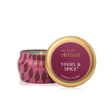 Capri Blue Artisan Tinsel & Spice mini tin candle with gold lid on a white background. Available at Be Charmed