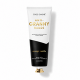 Chez Gagné Anti-Granny Hands hand cream in an orange vanilla scented tube. The squeeze tube is white on top and black on the bottom, with gold lettering. Available at Be Charmed