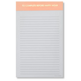 A lined notepad with a peach-colored header that reads 'TO COMPLETE BEFORE HAPPY HOUR' in white text. The notepad has horizontal gray lines on white paper and a small 'CHEZ GABINE' mark at the bottom right. Available at Be Charmed
