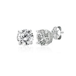 Pair of diamond stud earrings on a white background. Available at Be Charmed