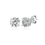 Pair of diamond stud earrings on a white background. Available at Be Charmed