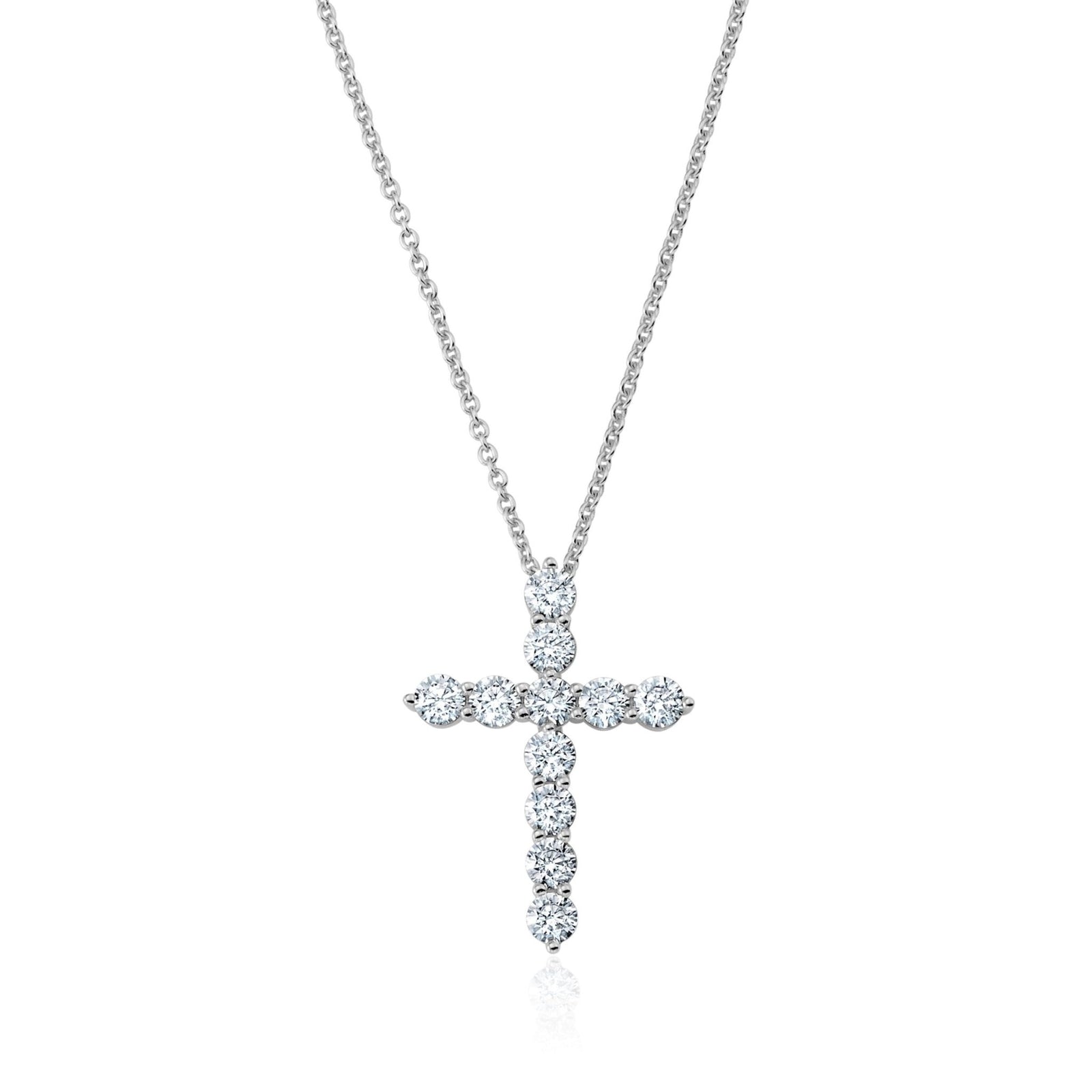 CZ cross necklace on a white background. Available at Be Charmed