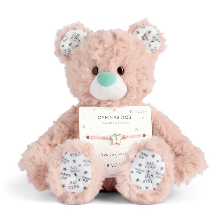 Demdaco Plush teddy bear with a gymnastics-themed bracelet on a white background. Available at Be Charmed