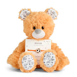 Demdaco Plush teddy bear with a soccer-themed bracelet on a white background. Available at Be Charmed