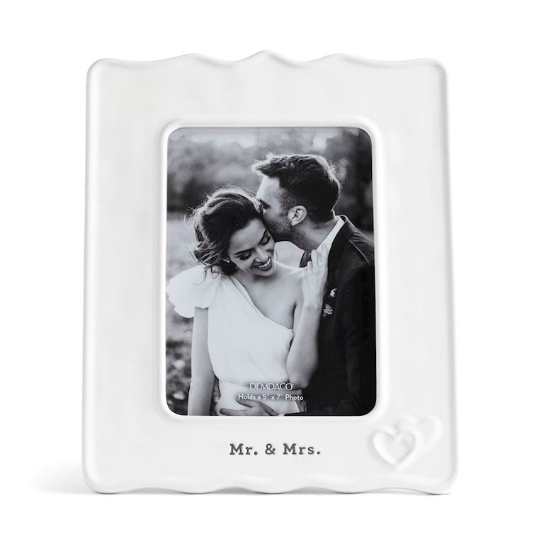 White Demdaco 'Mr. & Mrs.' photo frame with a black and white photo of a couple inside. Available at Be Charmed