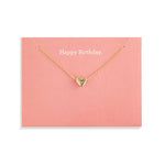 Demdaco Gold heart necklace on a pink card with 'Happy Birthday' text. Available at Be Charmed