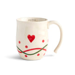 Demdaco White mug with red heart and green ribbon design on a white background. Available at Be Charmed