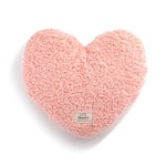 Demdaco weighted coral heart-shaped pillow on a white background. Available at Be Charmed